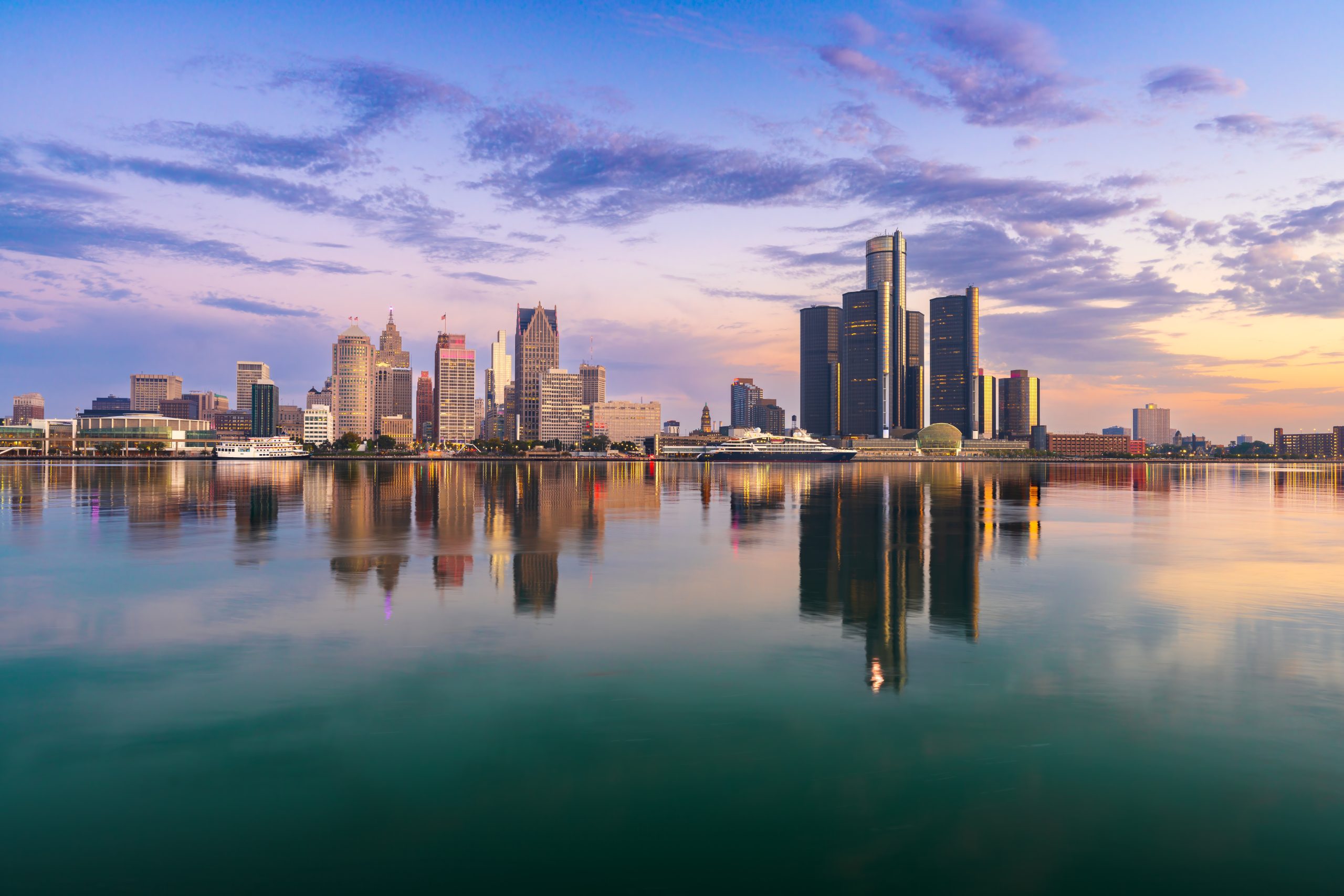 Detroit, Michigan, USA skyline at dawn on the Detroit River.