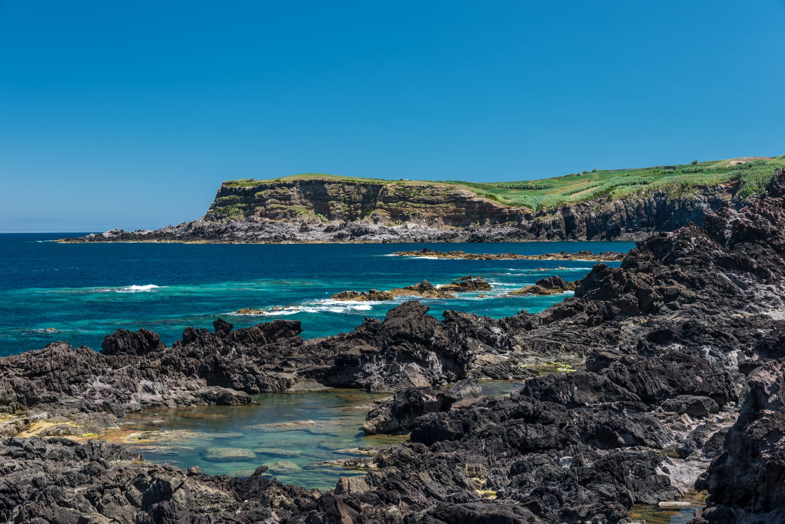natural pool in terceria, view of the rocky seaside in terceira with natural pool to have a bath, seascape in azores, portugal.
