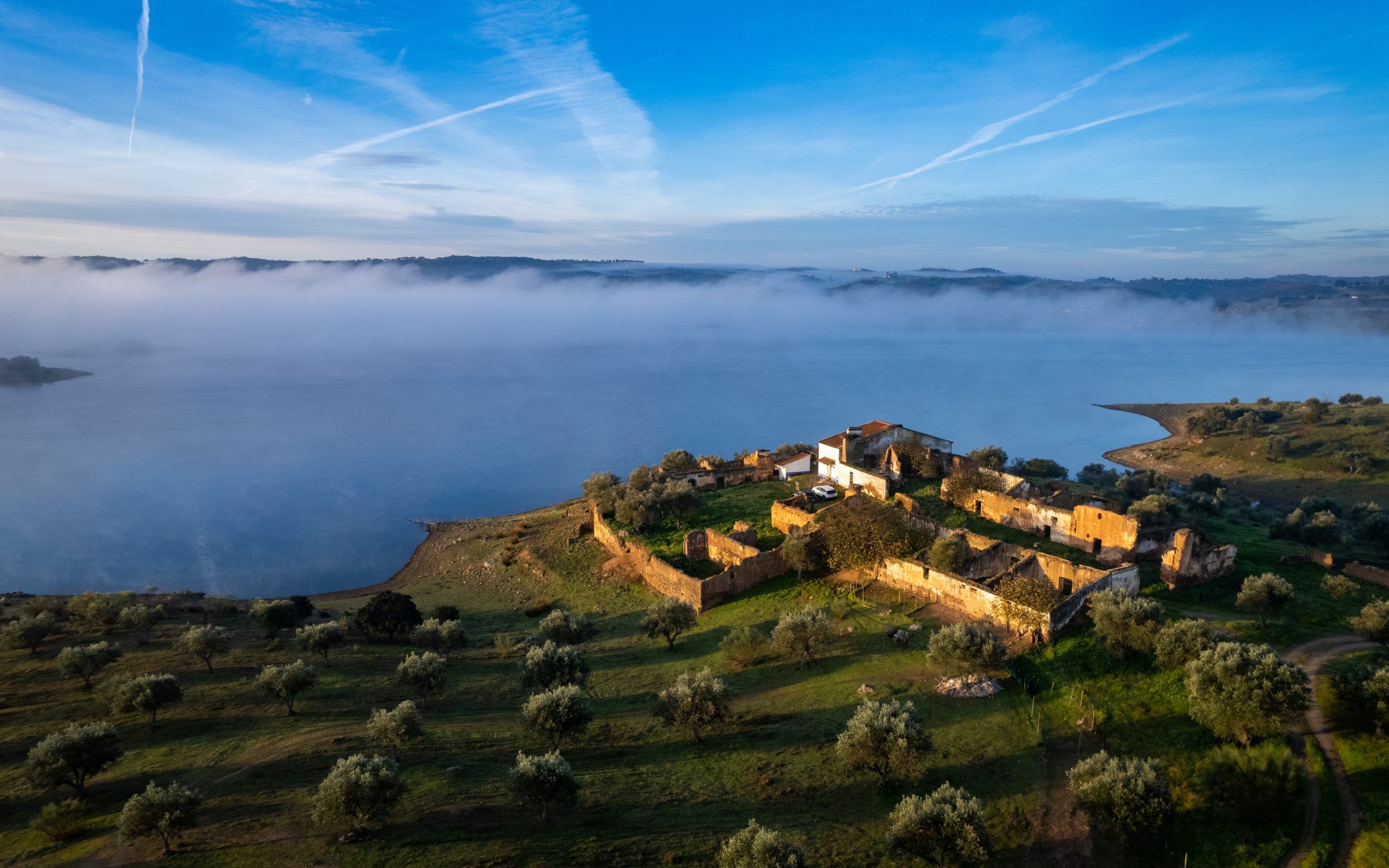 Morning country house on the lake. Alqueva, Portugal. Aerial drone photo
